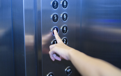 close-up-human-finger-is-pushing-elevator-button.jpg
